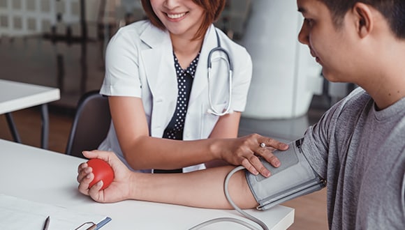 Young man getting his blood pressure checked