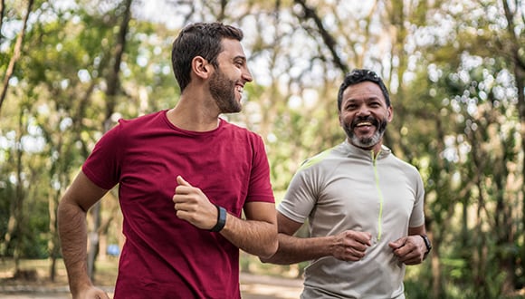 2 men running together enjoying the benefits of the outdoors