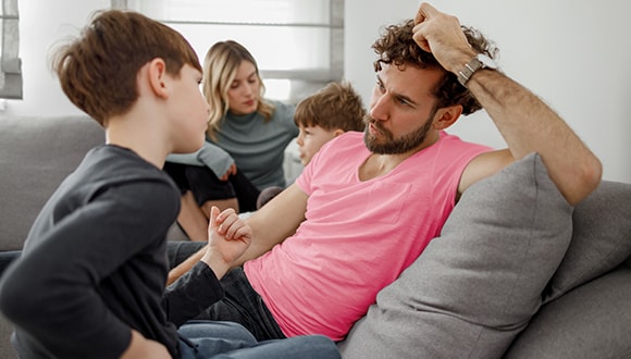 A family talking on the couch