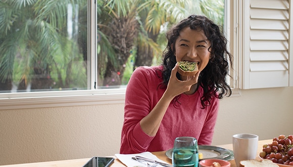 Woman eating a toast