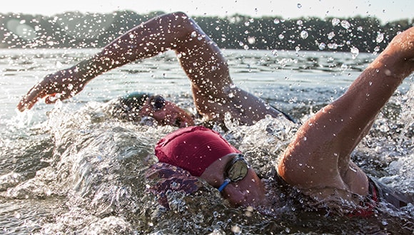 people ocean swimming