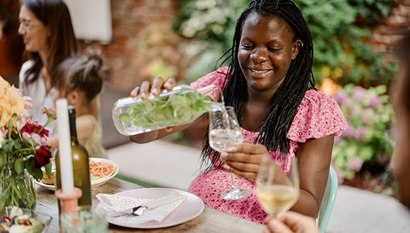 Woman maintaining a balanced relationship with alcohol by drinking water