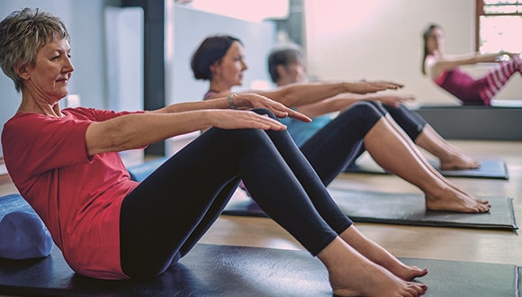 Two ladies exercising together to help manage their anxiety