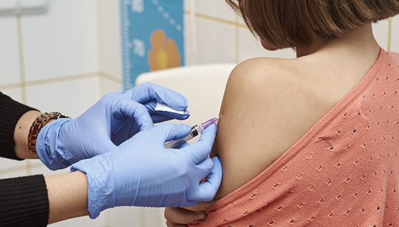 doctor giving vaccine to patient