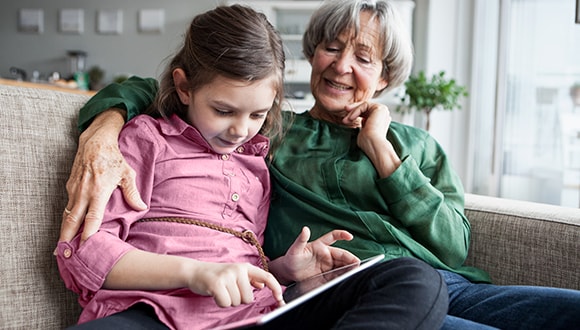 Common signs and symptoms of depression: grandmother with her granddaughter