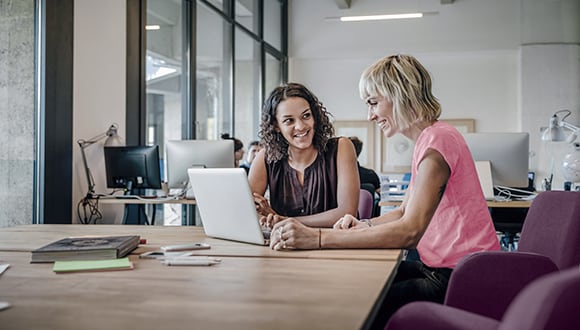 Two women working in an office