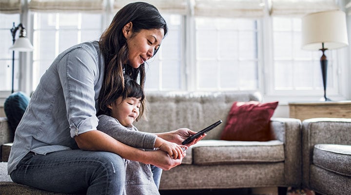 Mum and daughter using a health app