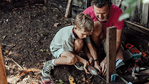 Father and son in the garden doing some family bonding