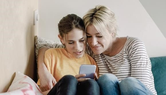 Two women looking up eating disorder symptoms