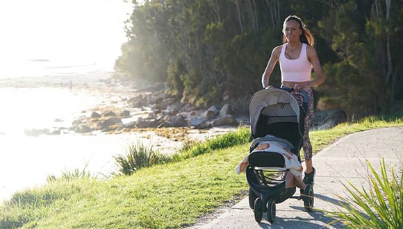 Turia Pitt running with a pram