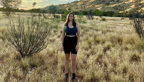 Lady standing front on for a camera while talking about running programs