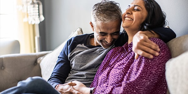 Couple reconnecting with each other while on the couch