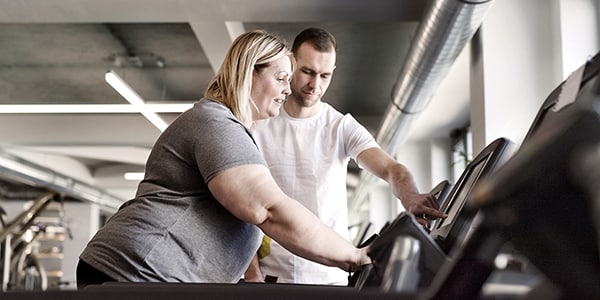 A woman exercising on a treadmill