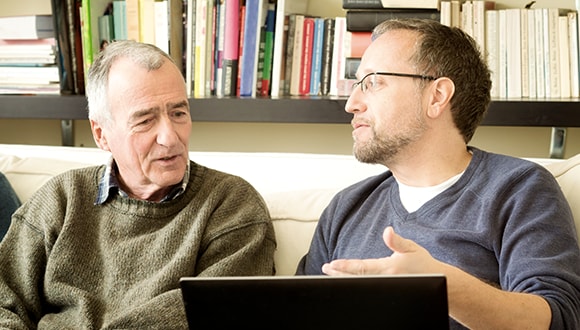 Two males talking to one another