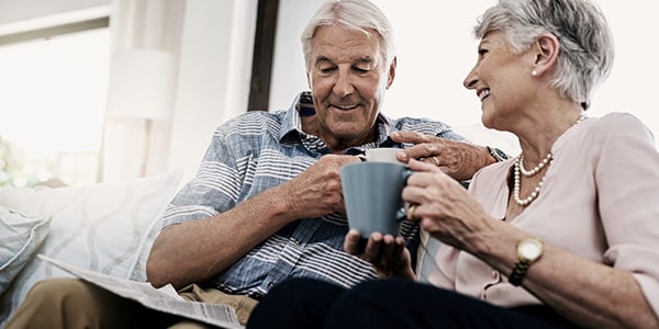 A senior couple enjoying talking and enjoying tea