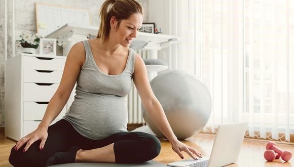 Pregnant woman researching pregnancy incontinence