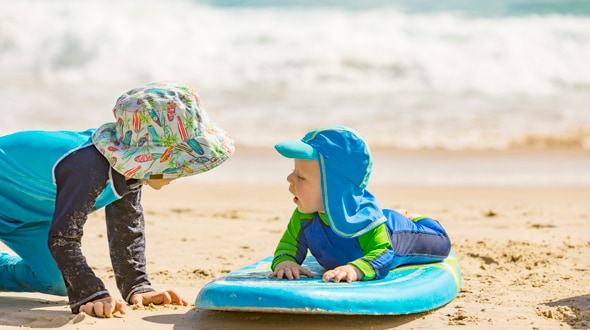 Two children playing on the beach