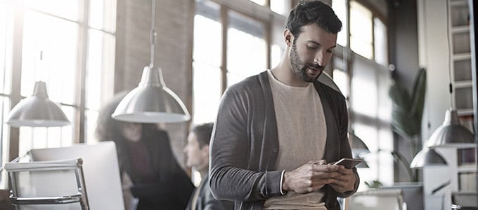 man looking at phone